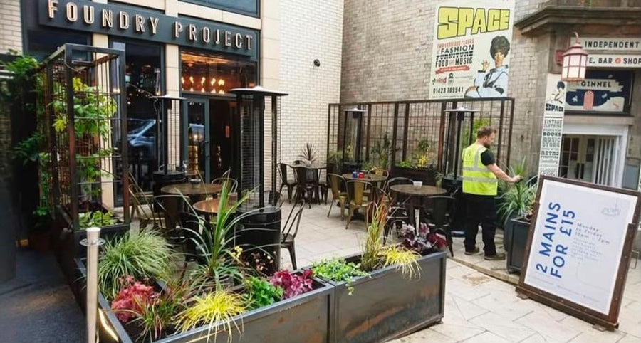 Planted metal trough beds on the outdoor terrace of the Foundry Project bar and restaurant in Harrogate