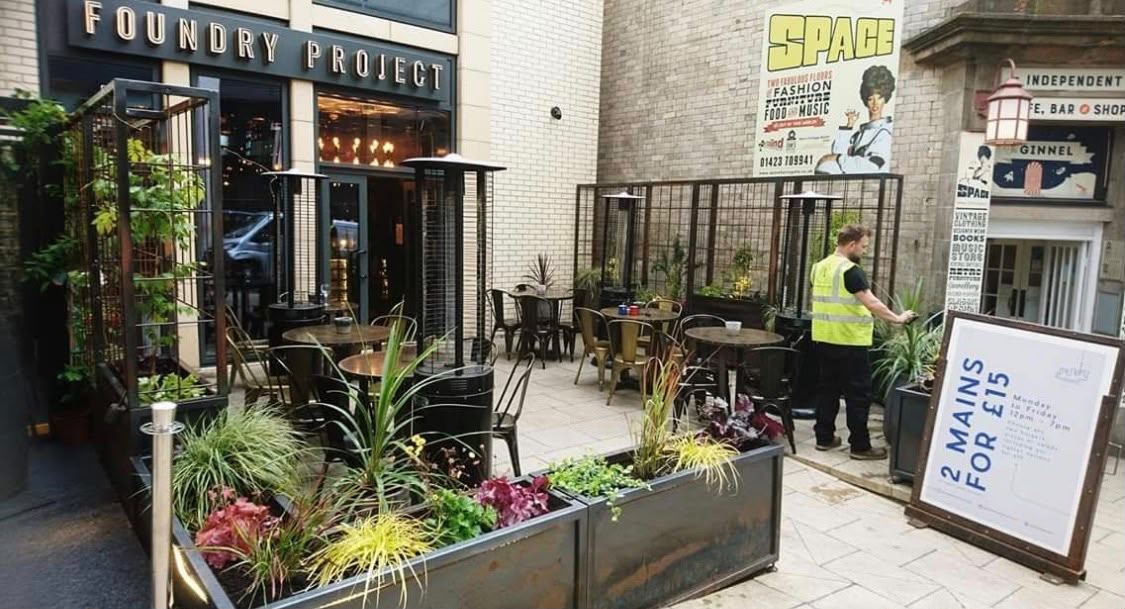 Planters kept planted and maintained on a bar and restaurant terrace