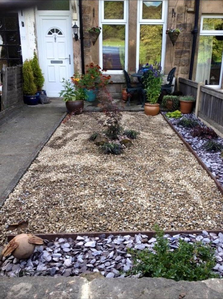 A town house front garden made over with gravel, slate edging and an acer