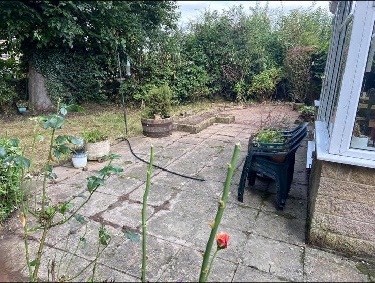 The same garden and patio cleared back and tidied