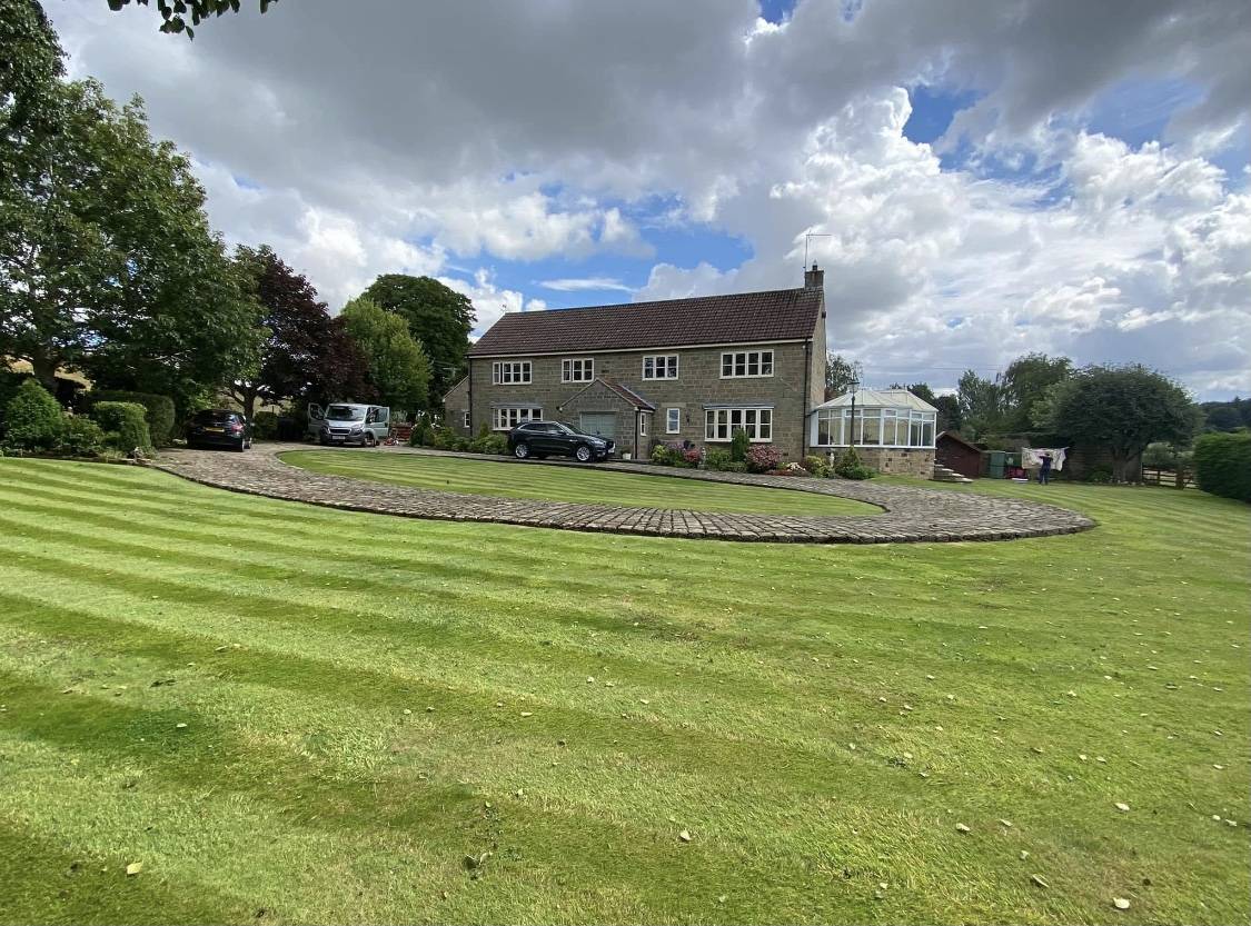 A freshly mown and striped lawn at a Nidderdale property