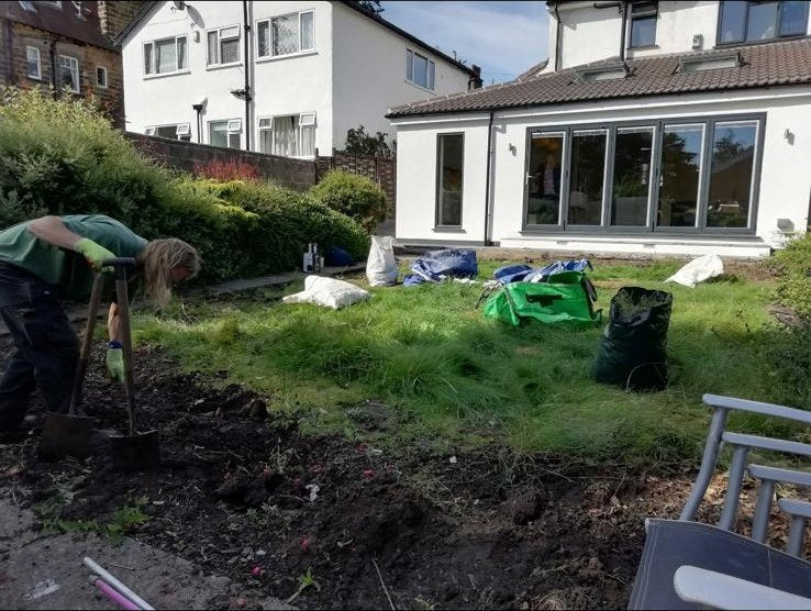 Stripping and digging over rough grass before new turf goes down